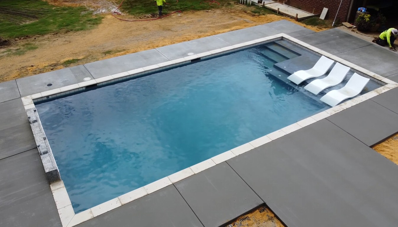 New concrete pool deck installed around a residential swimming pool in Campbell, CA