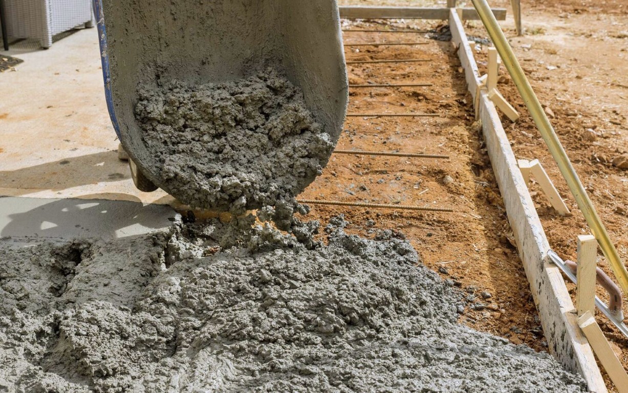 Concrete sidewalk being poured with formwork in a Campbell, CA neighborhood