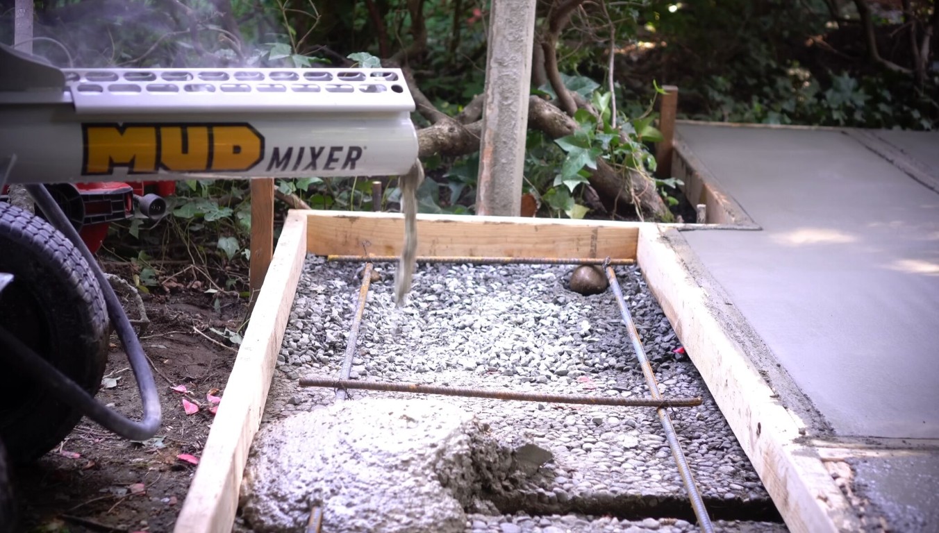 Concrete slab being poured with rebar and formwork at a job site in Campbell, CA
