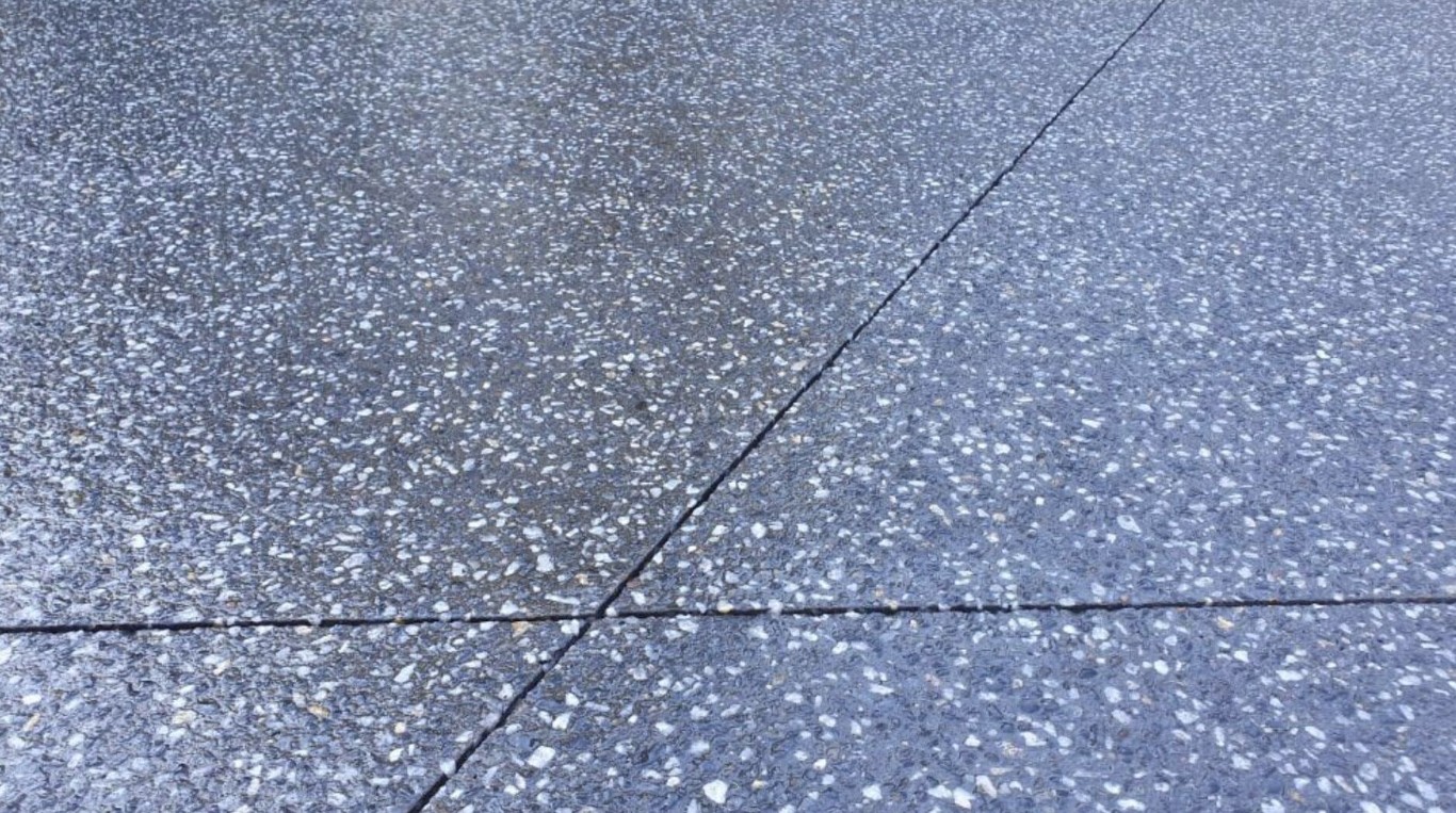 Decorative exposed aggregate concrete garage floor finish in Campbell, CA